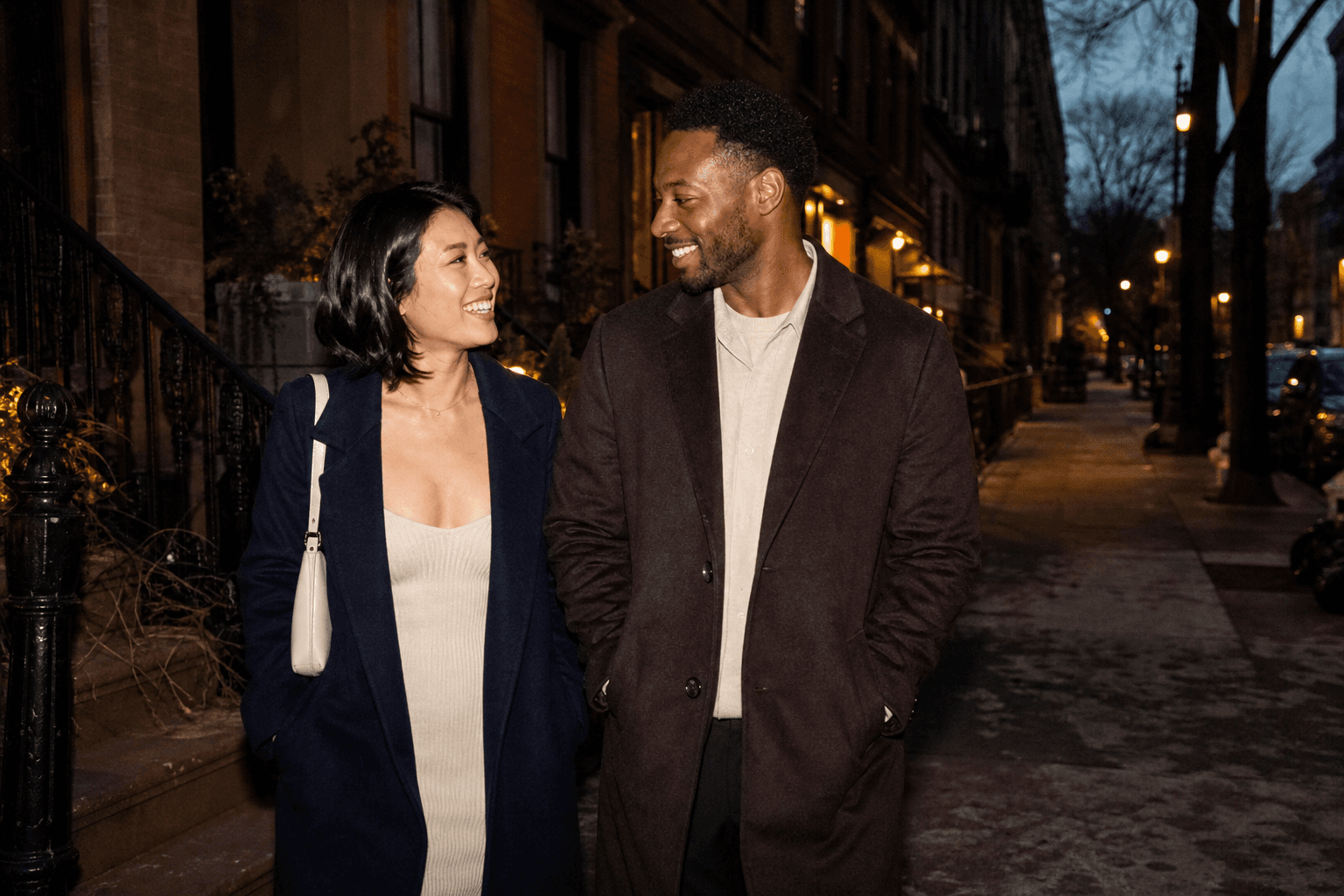 Two people continuing a conversation while walking through the city